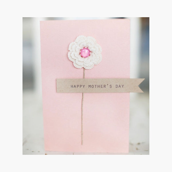 A Mother's Day card featuring a soft cotton flower detail.