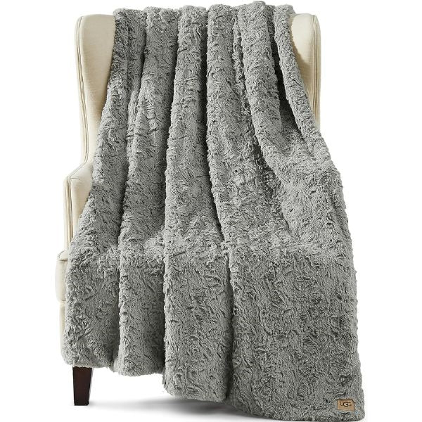 Cozy Throw Blanket, a warm and comforting engagement gift for couples to snuggle up in love.