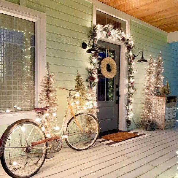 Doorway illuminated by elegant christmas light decorations, signaling festive cheer