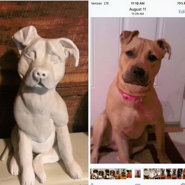Handcrafted custom dog sculpture capturing the likeness of a beloved pet.