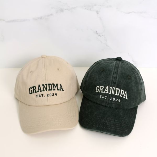 Custom embroidered hats with 'GRANDMA' and 'GRANDPA' on them, a stylish gift for the modern grandparent.