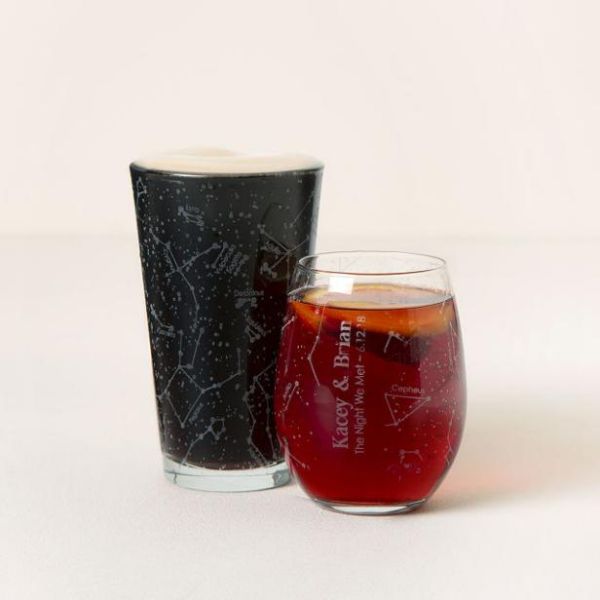 Custom sky glassware etched with constellations is a romantic Christmas gift for couples.