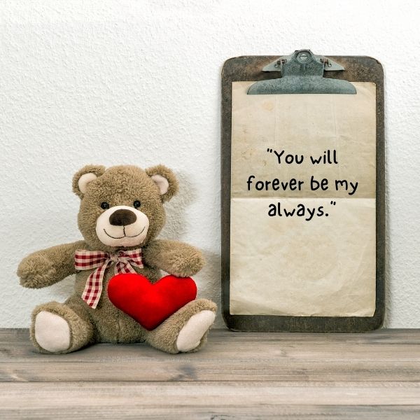 Adorable teddy bear holding a heart with cute Valentine's quotes