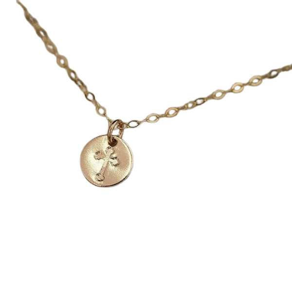 A delicate dainty gold cross necklace for a mom who cherishes her Christian beliefs