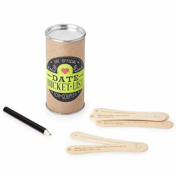 A collection of wooden sticks with date night ideas printed on them, contained in a cylindrical case for spontaneous planning.