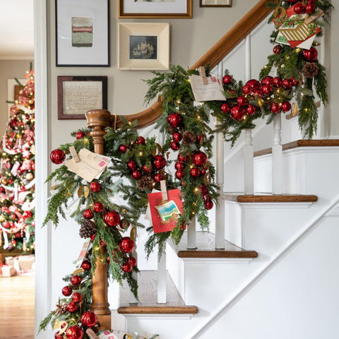 Elegant bannister adorned with evergreen garland and twinkling christmas light decorations for a festive home accent