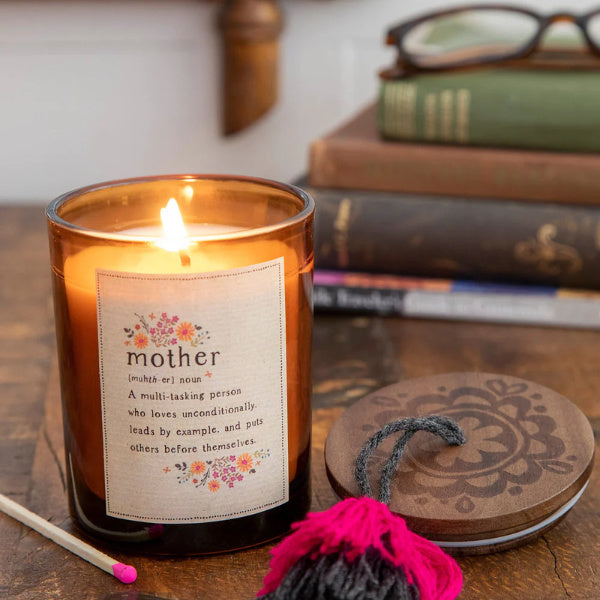 A beautifully scented Definition Candle, a symbol of tranquility and affection, a cherished wedding gift for mom to light up her special day.