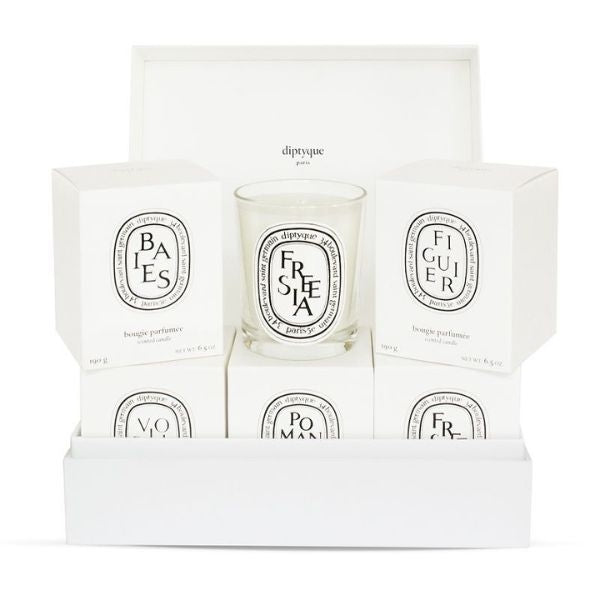 Personalize her space with the Diptyque Build Your Own Scented Candles Set, a fragrant and sophisticated anniversary gift for your wife.
