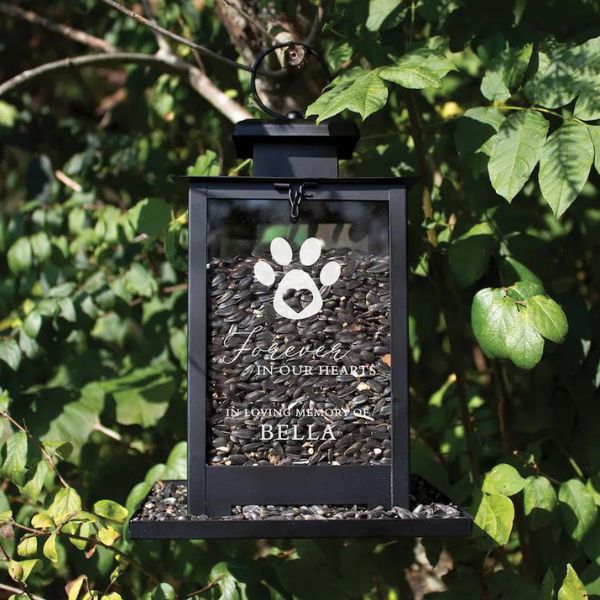 Dog memorial bird feeder with a heartfelt inscription, offering solace in nature's embrace.