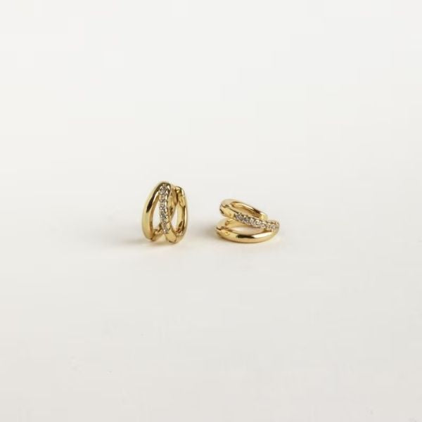 Double Hoop Huggie Earrings offer a modern twist to traditional 50th anniversary gifts, symbolizing eternal love.