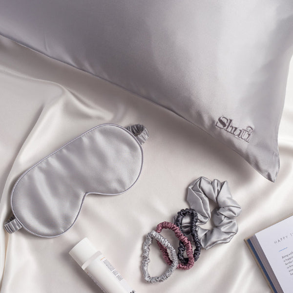 The dream set for new moms featuring a silk pillowcase, a sleep mask, and scrunchies.