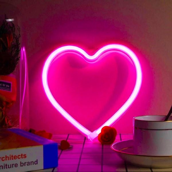 A cozy outdoor evening illuminated by the EXF Pink Heart Neon Sign, perfect for mom's relaxation.