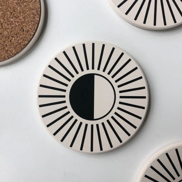 Eye-Catching Coasters are unique housewarming gifts for couples, protecting surfaces with a touch of flair.