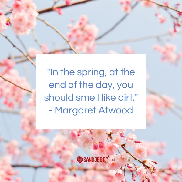 Pink cherry blossoms backdrop the famous Margaret Atwood quote about the essence of spring.