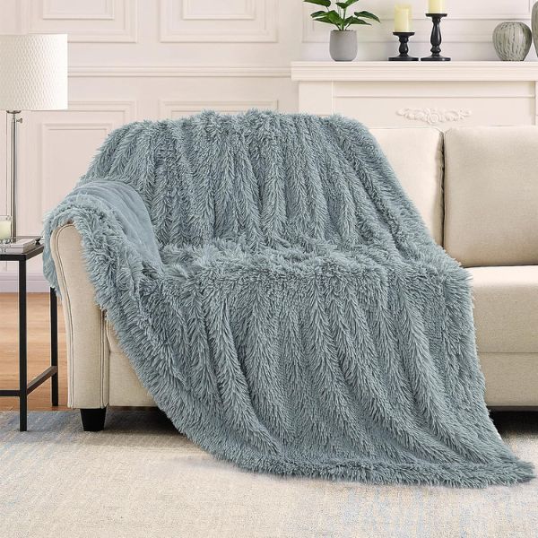 Wrap them in comfort with a Faux-Fur Throw Blanket - a cozy graduation gift.