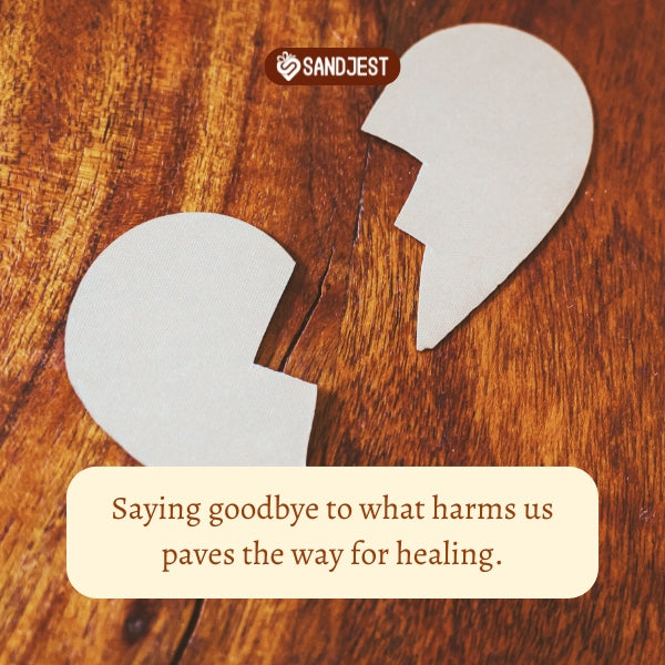 White paper heart split on wood, goodbye quotes heal past hurts