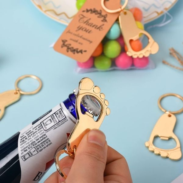 Footprint Keychain Bottle Openers With Gift Bags and Thank You Tags make a memorable statement in baby shower favors.