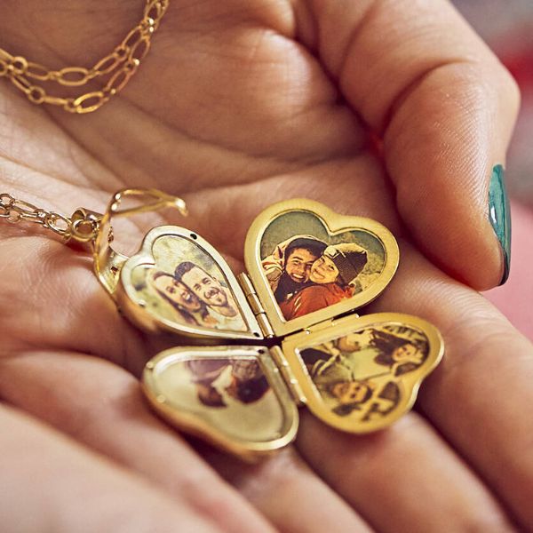 An enchanting locket containing cherished photos of friends, a sentimental and personalized anniversary gift