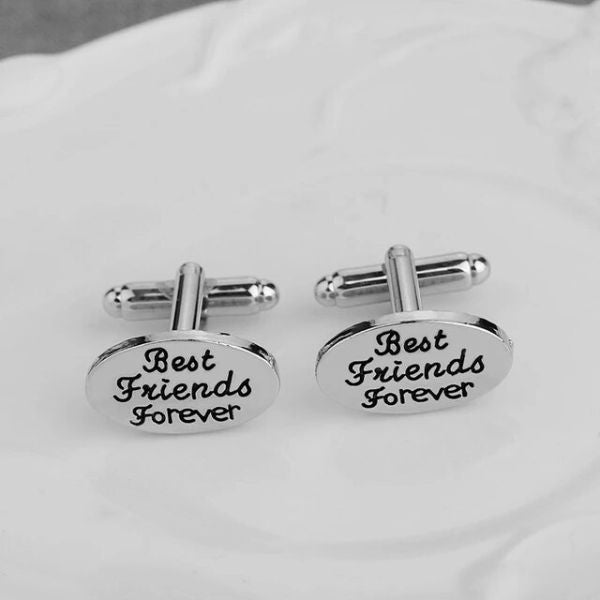 An elegant set of engraved cufflinks, each bearing the word "Friends," a sophisticated and personalized anniversary gift for friends