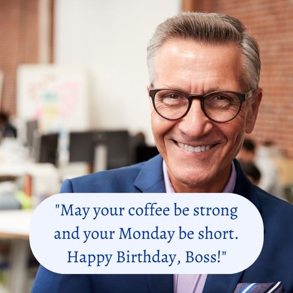 Smiling boss in a blue suit receiving funny happy birthday wishes.