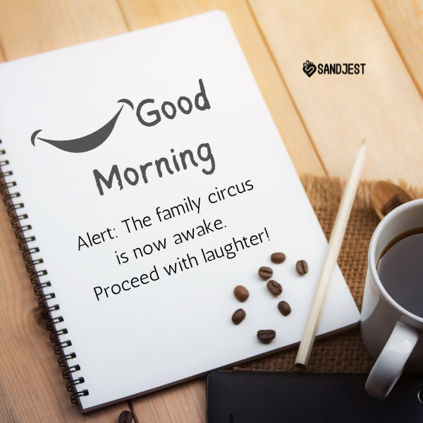 Notebook with a cheerful good morning greeting and coffee, featuring funny good morning quotes.