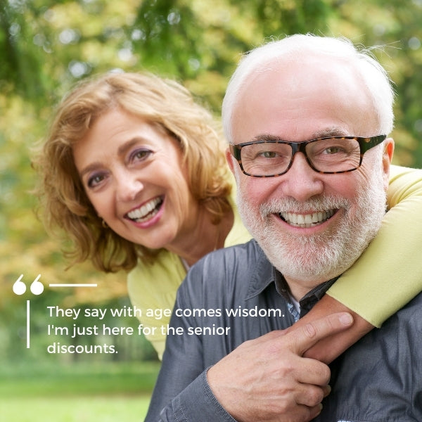 Cheerful senior couple with a funny quote about preferring senior discounts over wisdom.