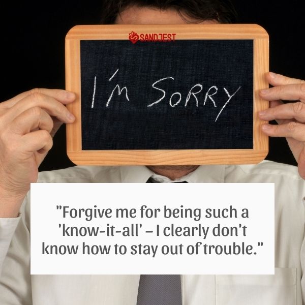 Man holding a chalkboard with "I'm Sorry" written on it, depicting a funny sorry message.