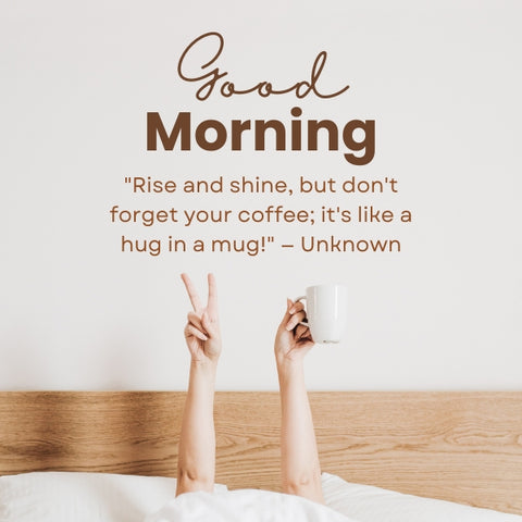 Hands holding a coffee mug and making a peace sign from under a blanket, with the text "Good Morning" and a coffee quote on the wall.