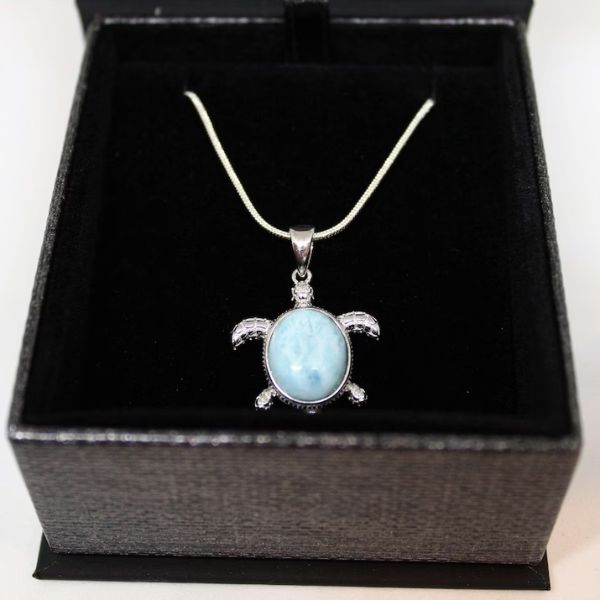Embrace the tranquility of the sea with this Genuine Larimar Sea Turtle Necklace.