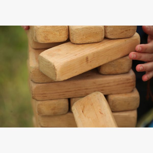 Elevate game night with the Giant Lifesize Jenga Game, a fun and interactive DIY gift for sisters who enjoy playful competition.