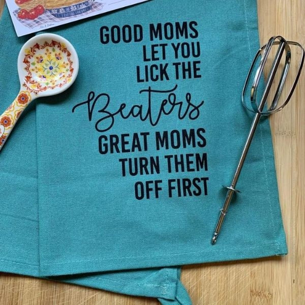 Gag 'Good Moms Let You Lick the Beaters' kitchen towel for Mother's Day.