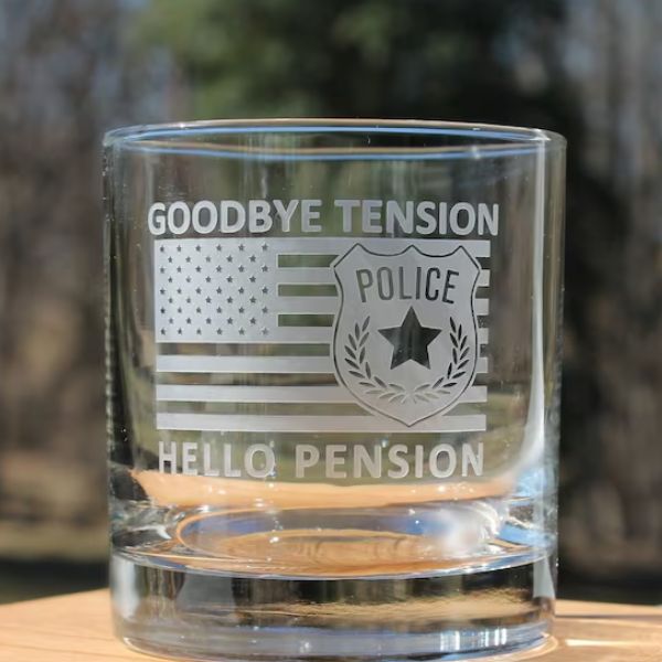 Goodbye Tension Hello Pension Rocks Glass, a humorous addition to police retirement gifts.