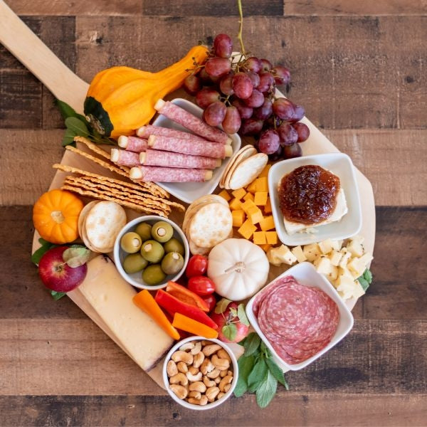 Delight her taste buds with the Gourmet Cheese and Charcuterie Board, a sophisticated and savory anniversary gift for your wife.
