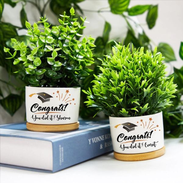 Add greenery to their space with a Graduate Planter - a decorative graduation gift.