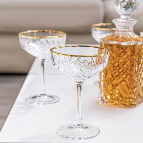 Hand Crafted Gold Rimmed Champagne Coupes are a bespoke 50th anniversary gift, perfect for elegant toasts.