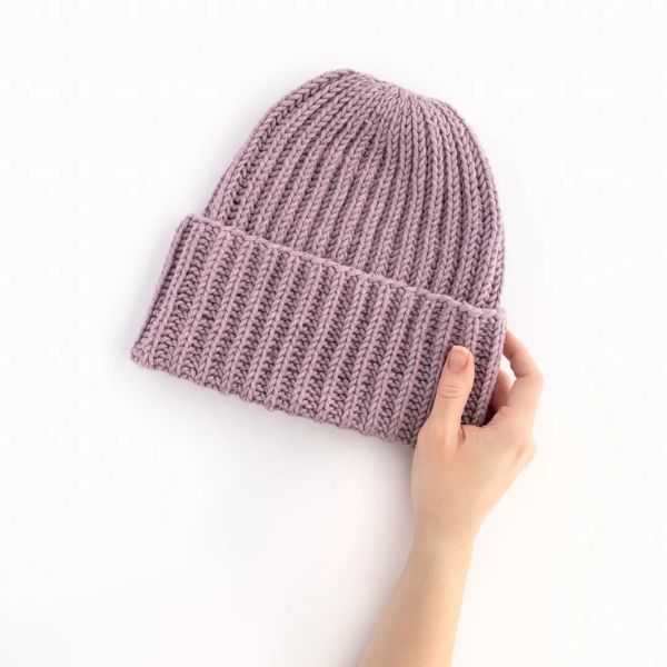 Stay warm in a Hand-Knitted Beanie, a cozy headwear choice.