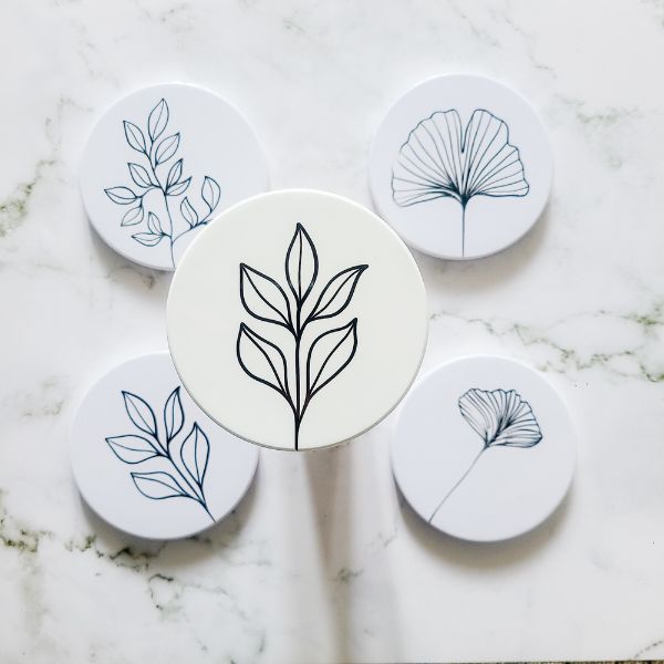 Set your cups down on Hand-Painted Coasters, a touch of artistry.