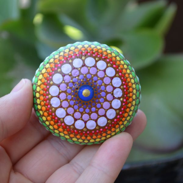 Admire the beauty of Hand-Painted Mandala Stones, unique art pieces.