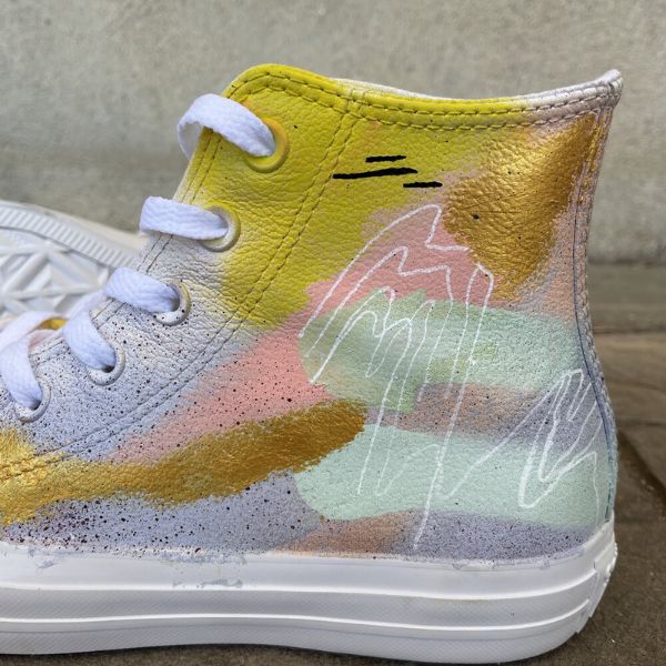 Walk in style with Hand-Painted Sneakers, a unique fashion choice.