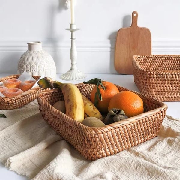 Hand-Woven Rattan Baskets are versatile housewarming gifts for couples, providing stylish storage solutions.