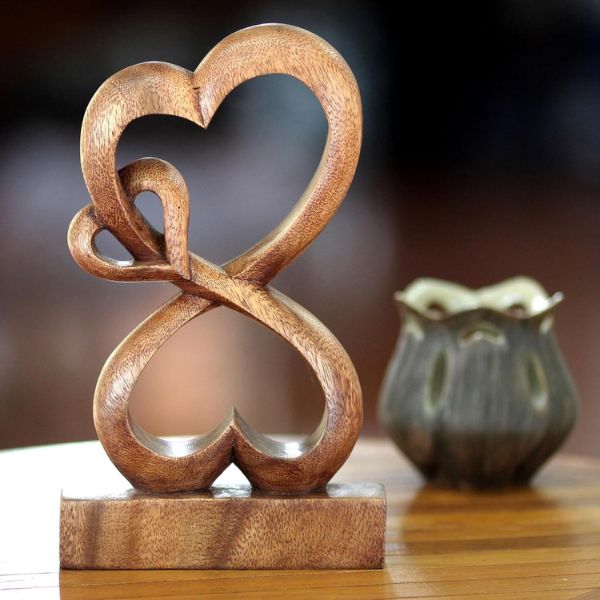 Handmade Heart Shaped Wood Sculpture, a romantic 5 year anniversary gift symbolizing enduring love.