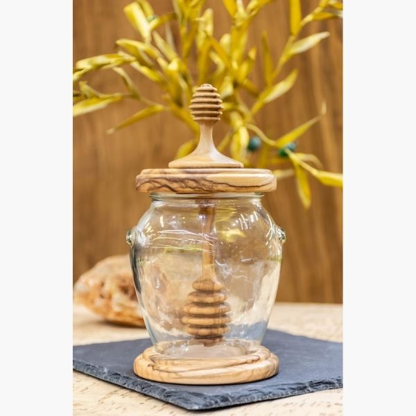 Handmade Olive Wood Honey Pot With Dipper brings a touch of rustic charm to baby shower favors.
