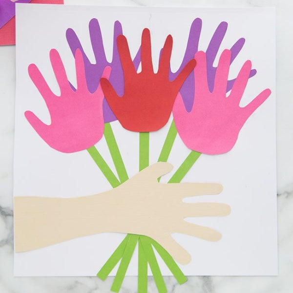 A mother's day card with colorful handprint cutouts forming a bouquet.