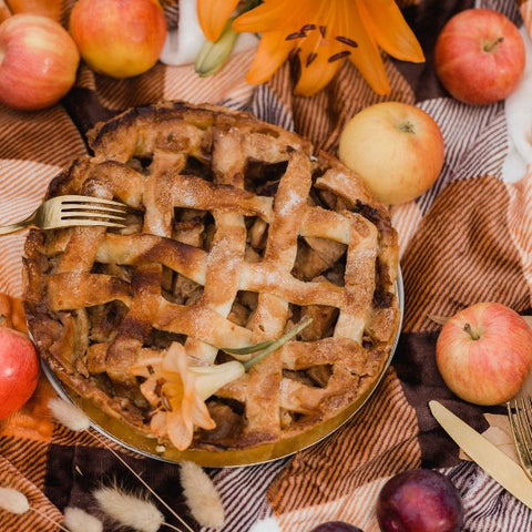 Freshly baked pie at a table set for harvest festivities in the fall.