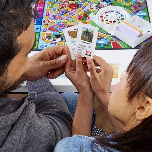 Hasbro Gaming The Game of Life Game is a nostalgic and fun 50th anniversary gift, reflecting on life's journey.