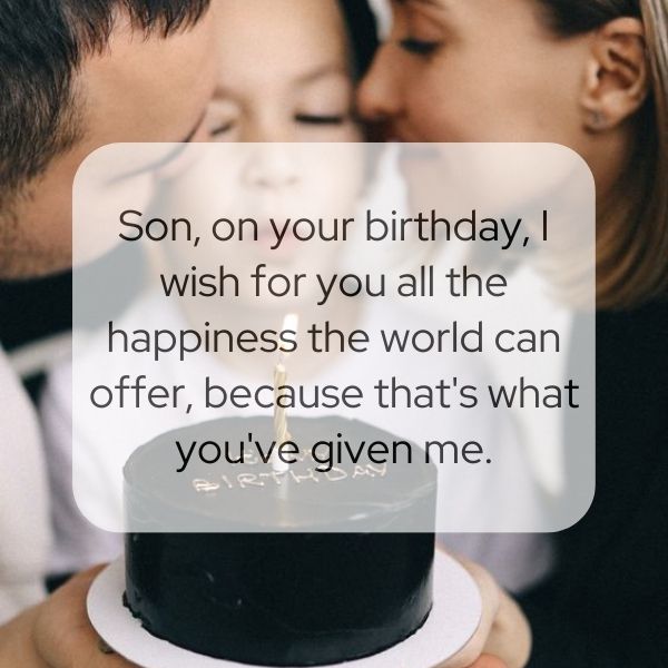 Tender moment between parents and son on his birthday with a chocolate cake.