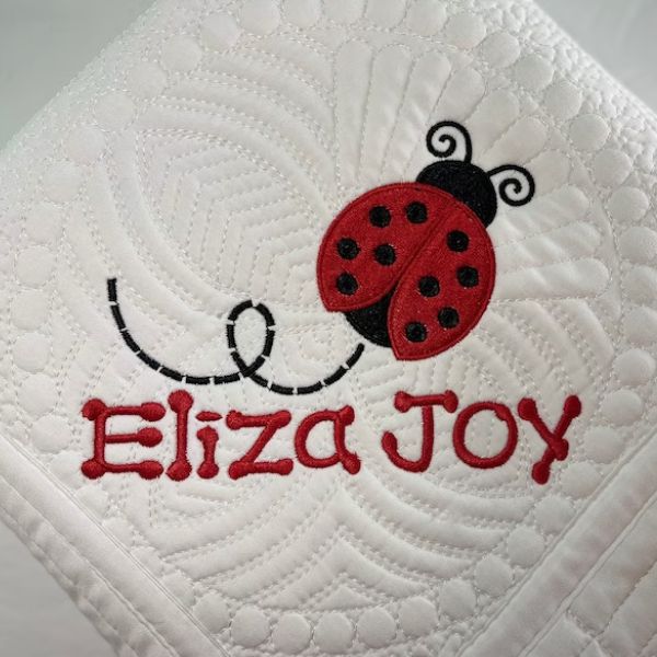 Love Bug Heirloom Baby Blanket, a keepsake Baby Valentine Gift for Babies.