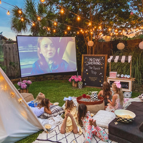Outdoor movie night, a creative and relaxed 50th birthday idea under the stars.
