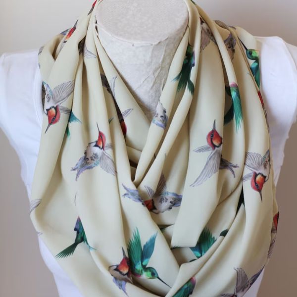 Hummingbird Infinity Scarf adds a touch of elegance to your outfit.