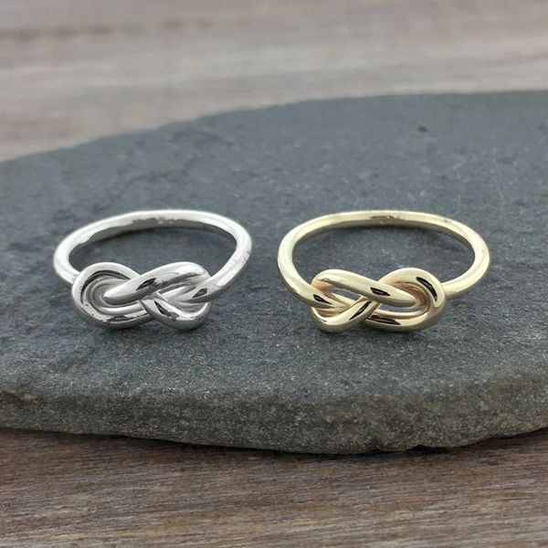 A beautifully crafted infinity knot ring, symbolizing eternal friendship, making it a elegant anniversary gift for friends.